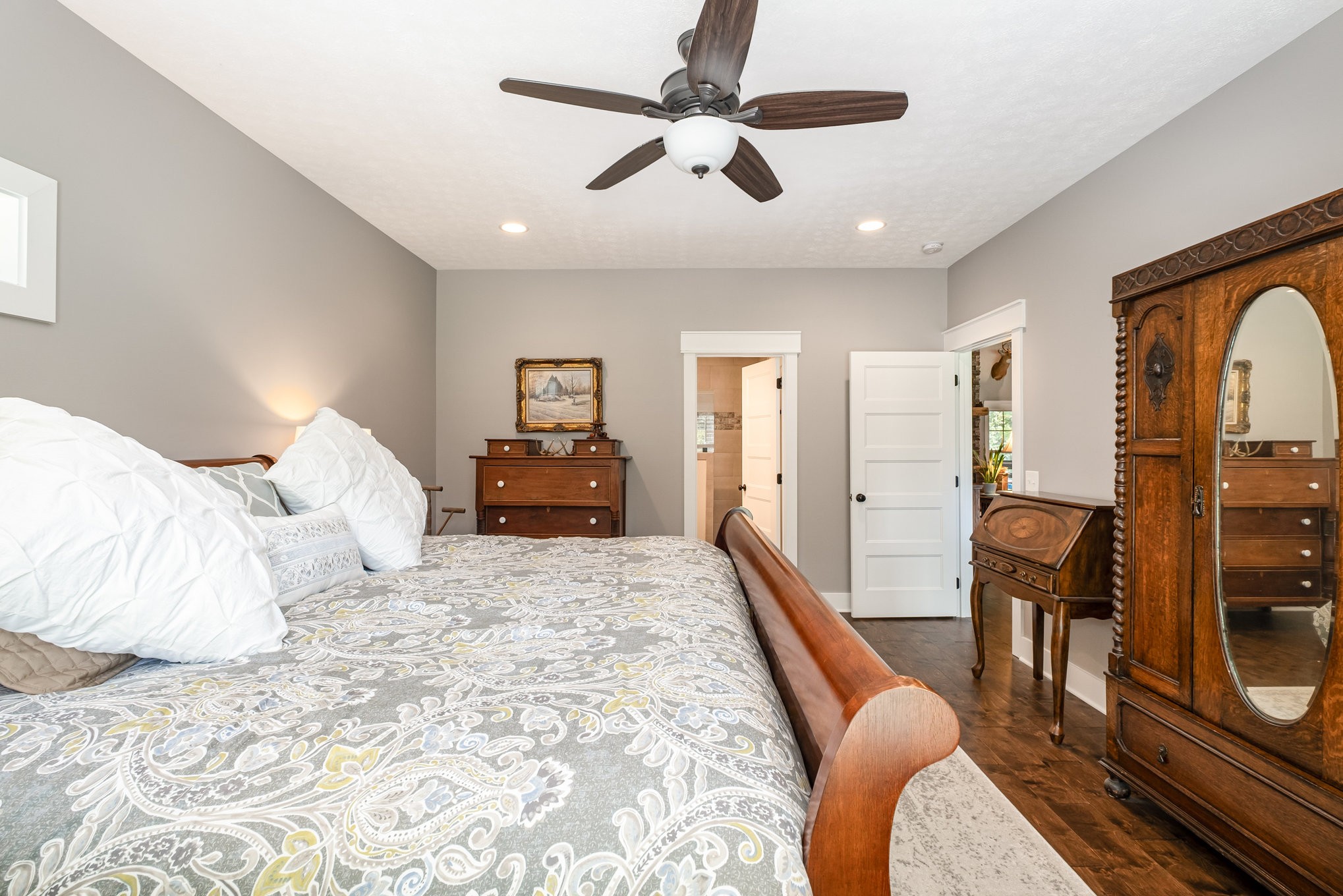 8129 Hollow Springs Road Bradyville, TN 37026 - Photo 21 of 42 a bedroom with a bed a couch and dresser