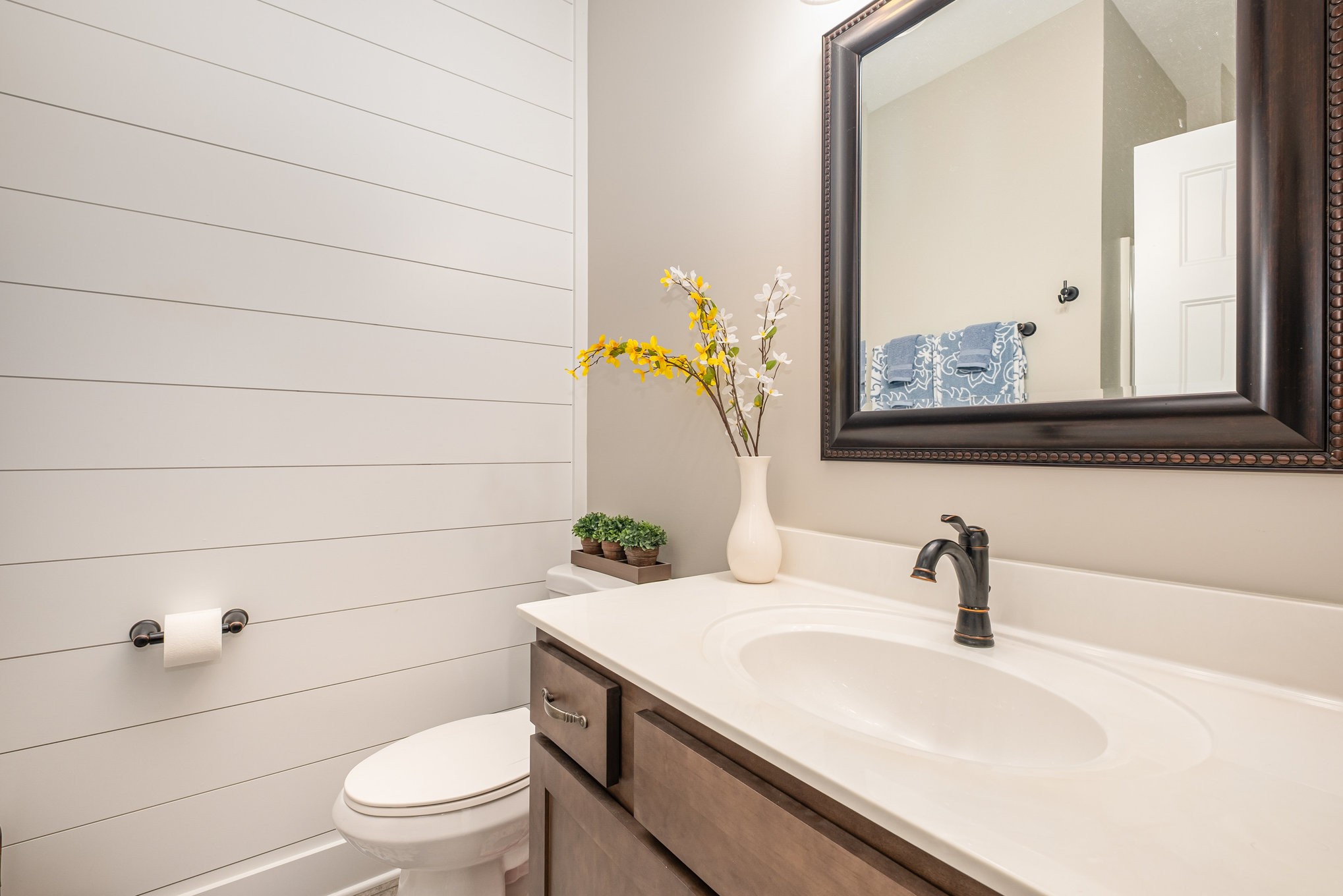 8129 Hollow Springs Road Bradyville, TN 37026 - Photo 24 of 42 a bathroom with a sink a toilet and mirror