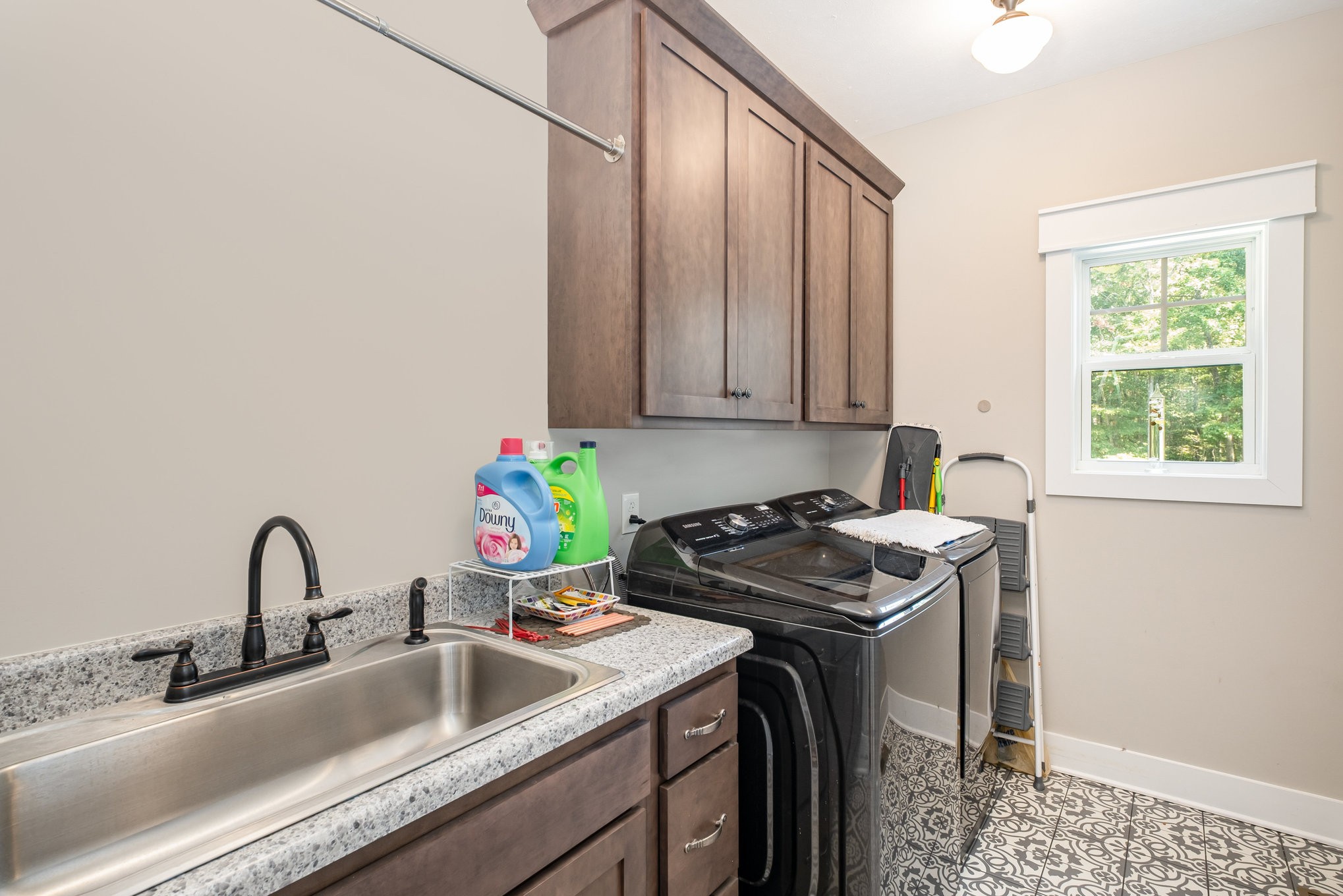 8129 Hollow Springs Road Bradyville, TN 37026 - Photo 26 of 42 a kitchen with stainless steel appliances a sink a stove and a window