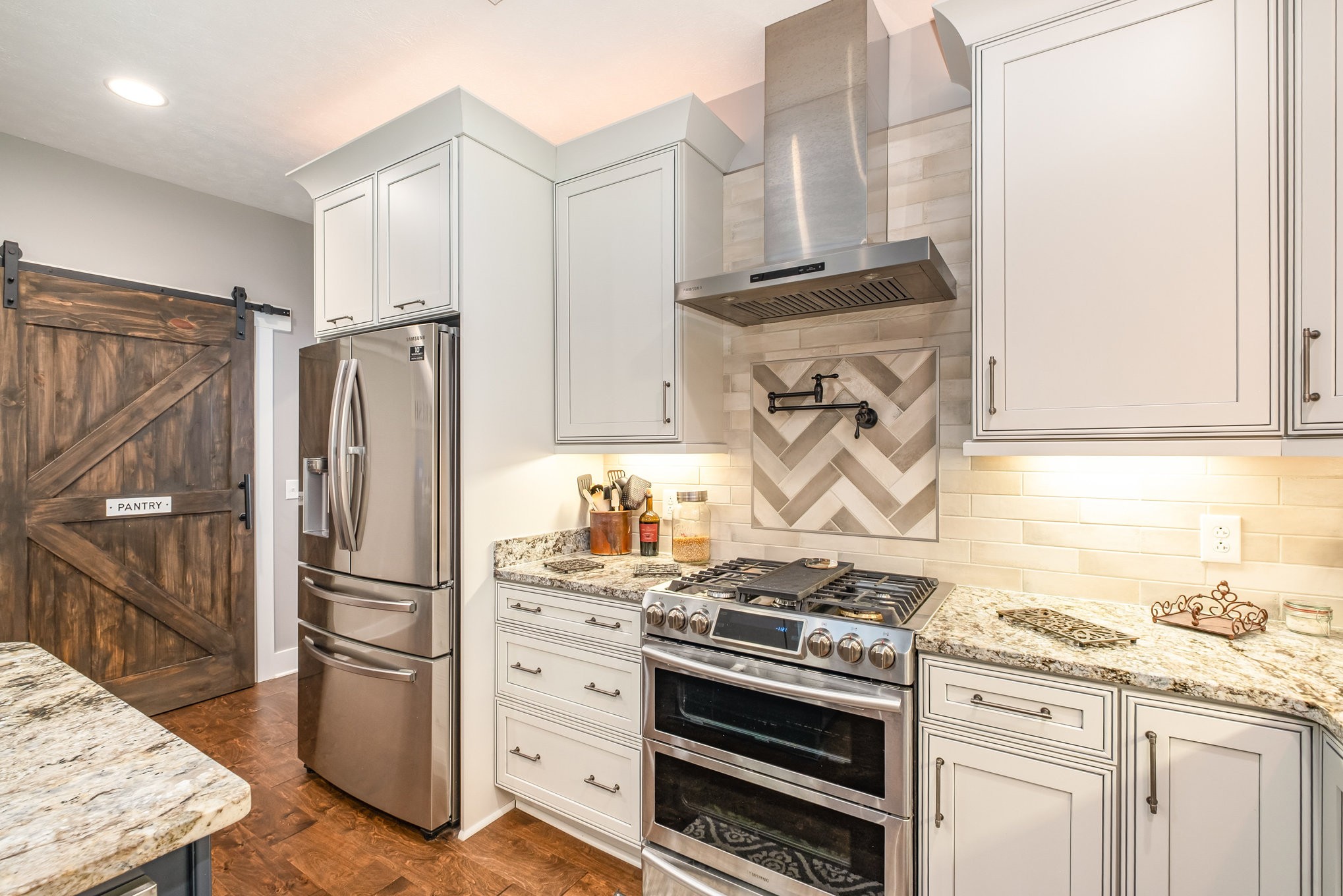 8129 Hollow Springs Road Bradyville, TN 37026 - Photo 27 of 42 a kitchen with granite countertop a stove and a refrigerator