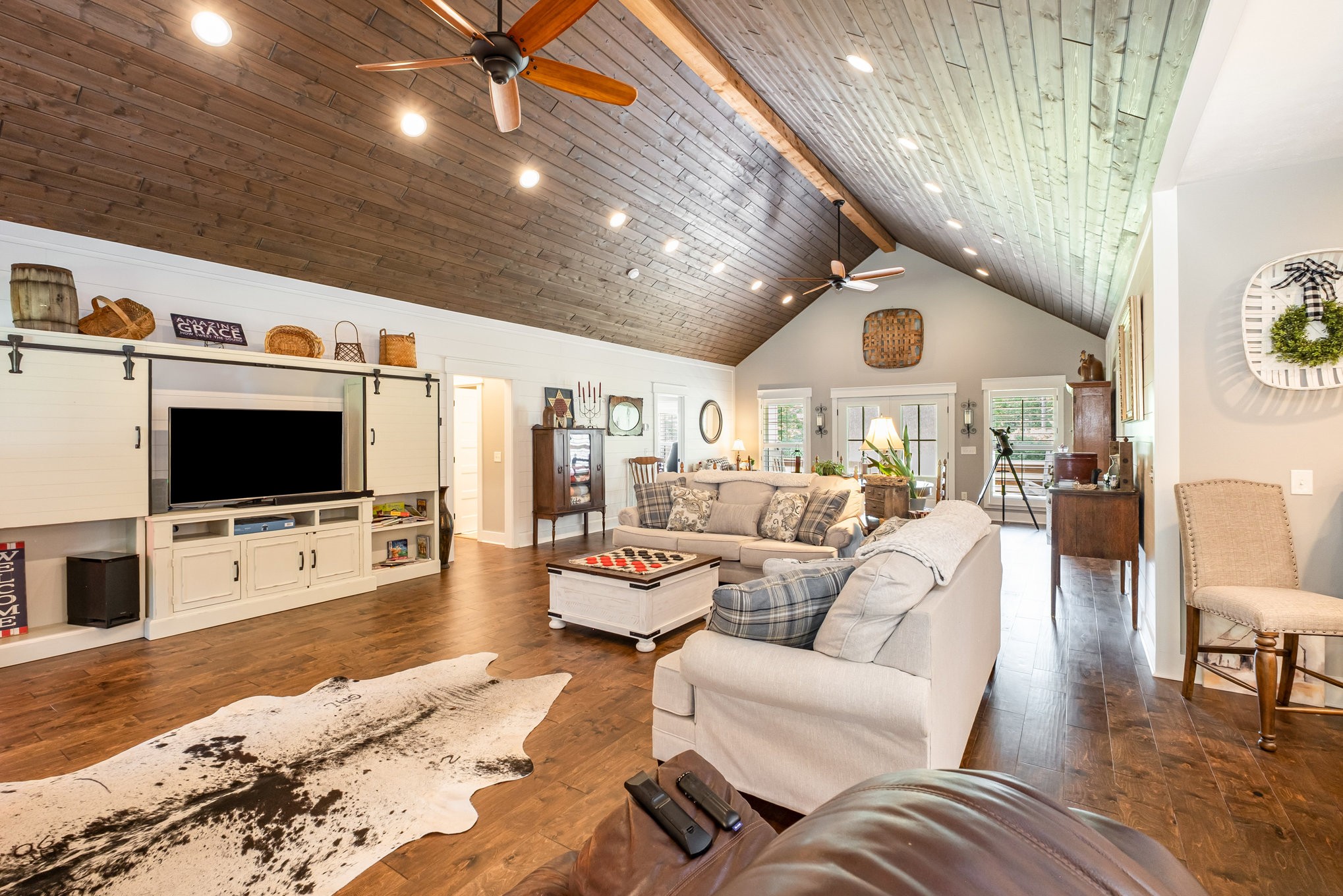 8129 Hollow Springs Road Bradyville, TN 37026 - Photo 33 of 42 a living room with furniture and a flat screen tv