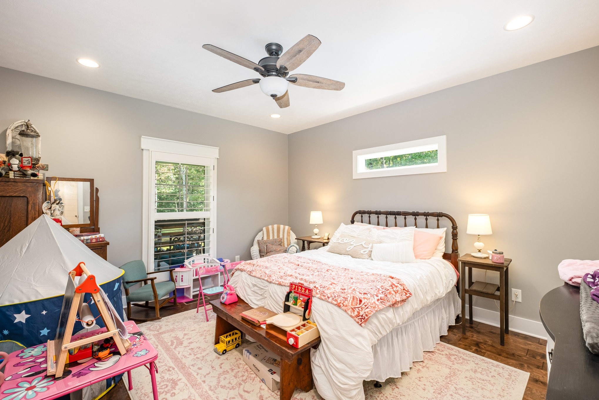 8129 Hollow Springs Road Bradyville, TN 37026 - Photo 37 of 42 a bedroom with a bed a dresser and a window