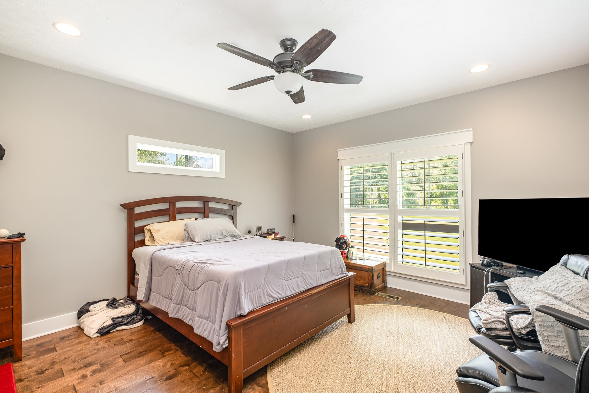 8129 Hollow Springs Road Bradyville, TN 37026 - Photo 38 of 42 a bedroom with a bed window and a ceiling fan