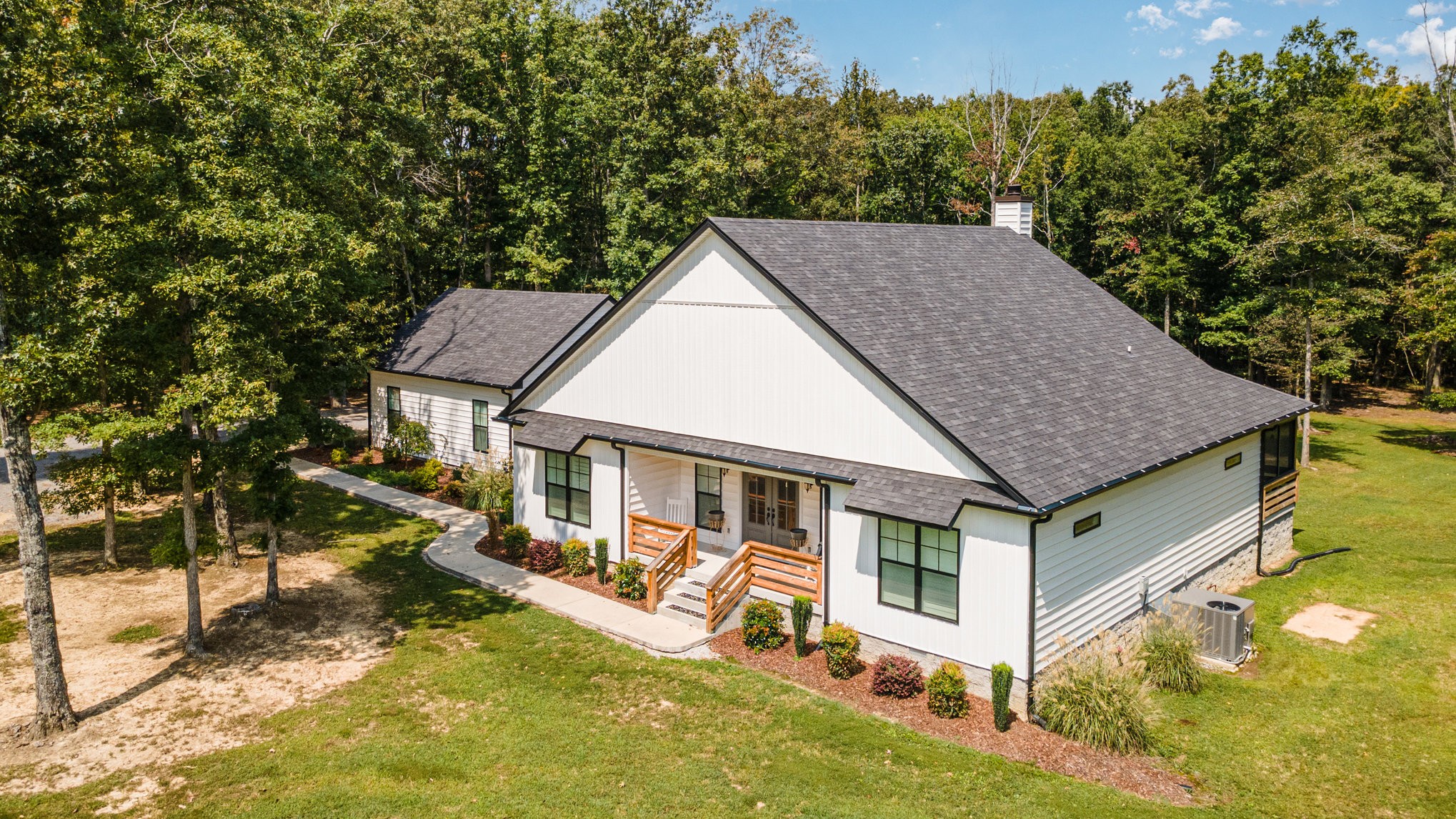 8129 Hollow Springs Road Bradyville, TN 37026 - Photo 5 of 42 a view of a house with a yard balcony and sitting area