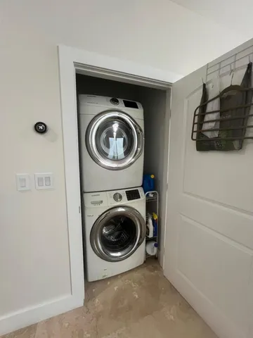 a bedroom with a bed and a flat tv screen