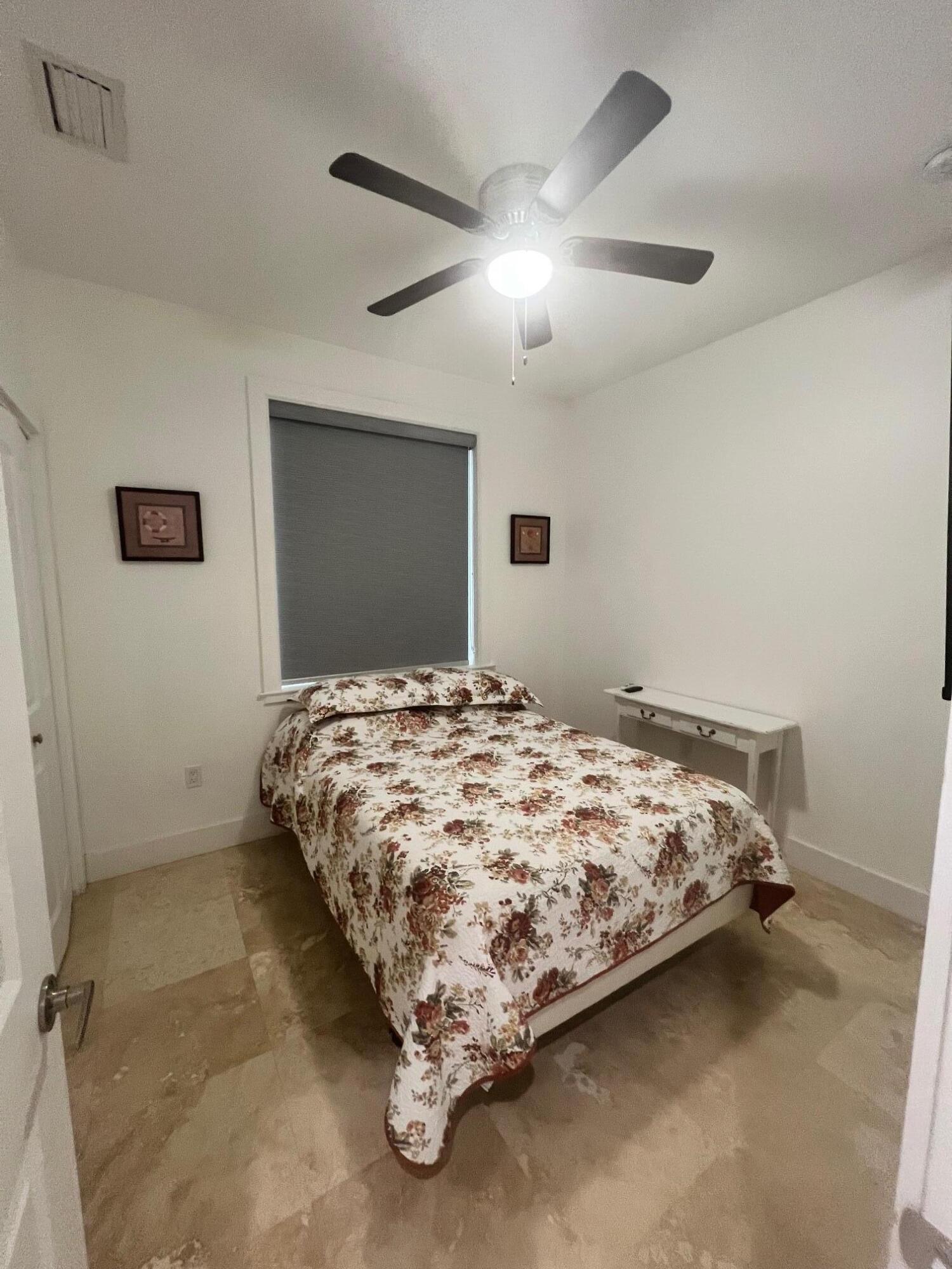 4 Pelican Road Key Largo, FL 33037 - Photo 8 of 15 a bedroom with a bed and a flat tv screen