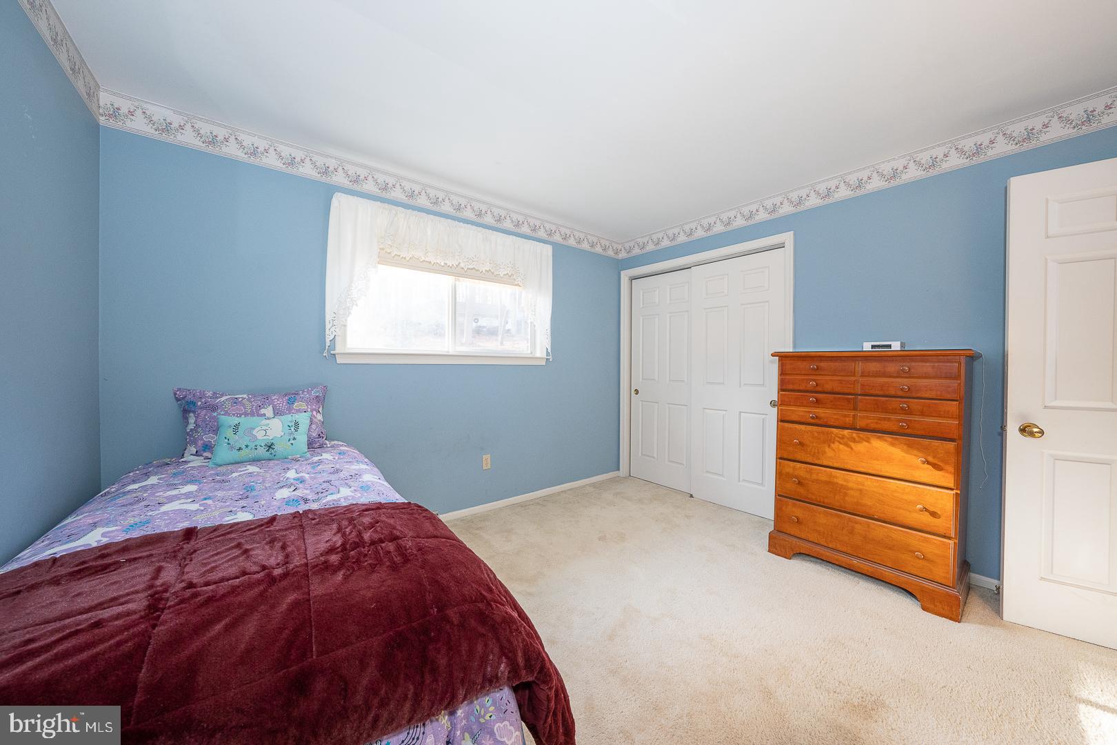 192 Maryhill Road Phoenixville, PA 19460 - Photo 15 of 35 a bedroom with a bed and a window