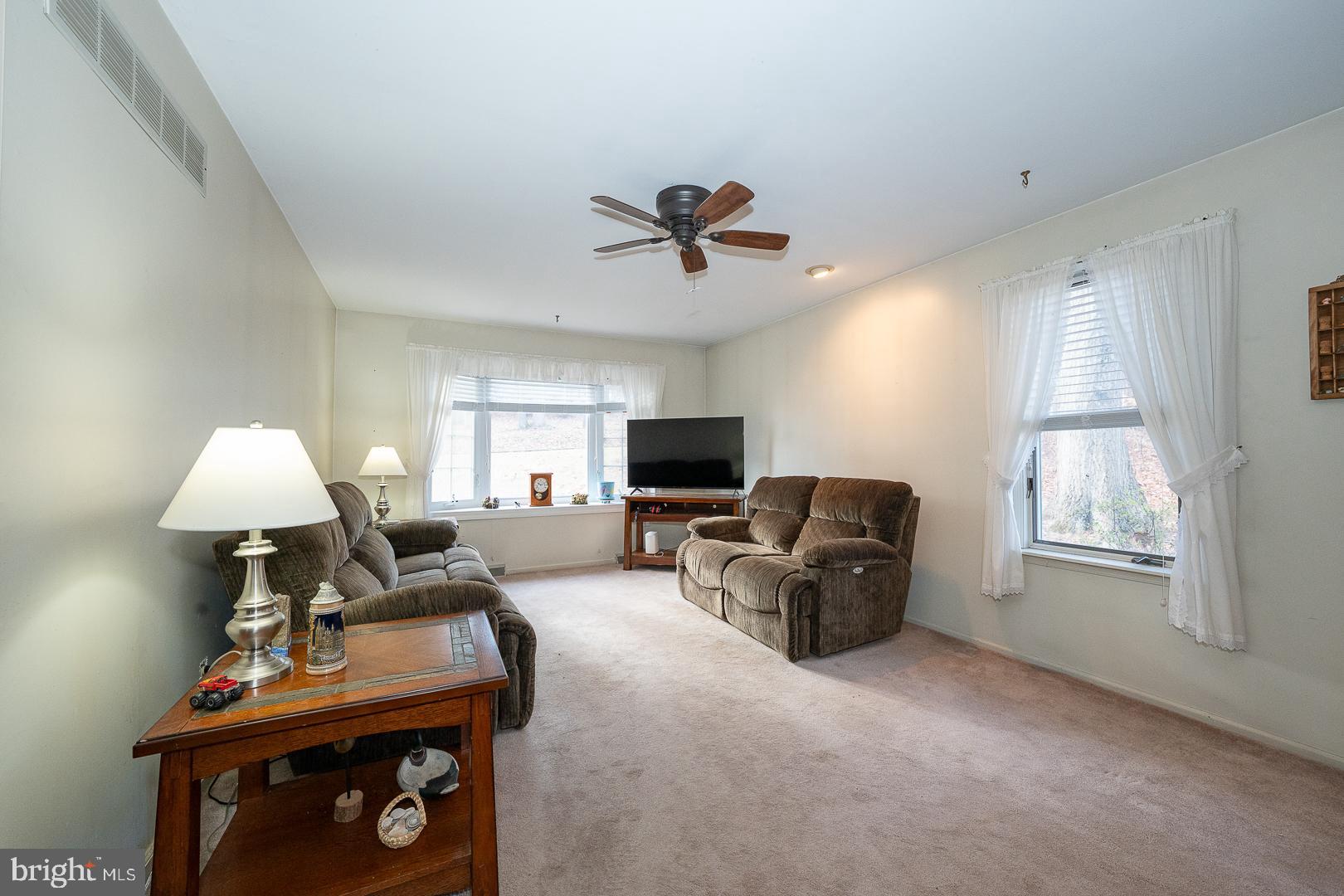 192 Maryhill Road Phoenixville, PA 19460 - Photo 4 of 35 a living room with furniture a flat screen tv and a window