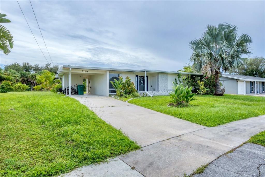 2254 Hayworth Road Port Charlotte, FL 33952 - Photo 11 of 48 a front view of house with yard and green space