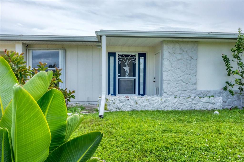 2254 Hayworth Road Port Charlotte, FL 33952 - Photo 12 of 48 a view of a backyard with plants