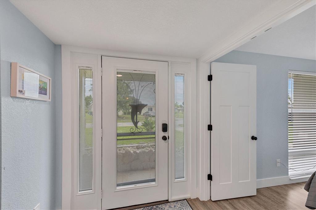2254 Hayworth Road Port Charlotte, FL 33952 - Photo 13 of 48 a view of a hallway with wooden floor and closet area