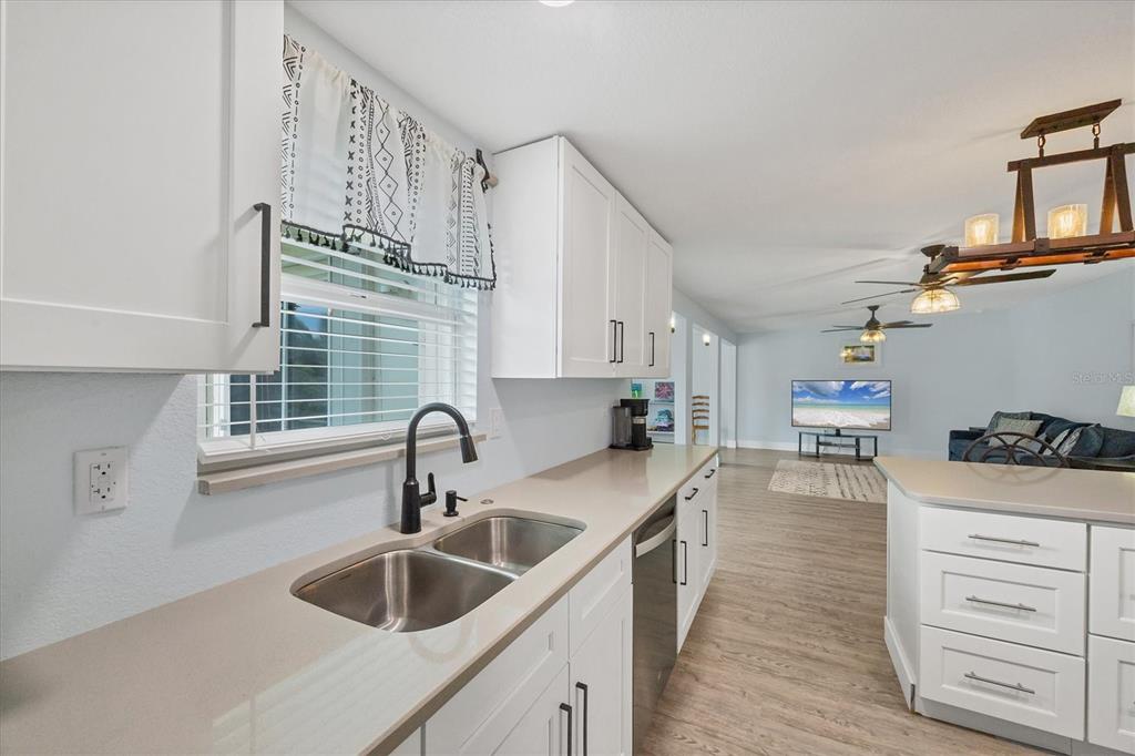 2254 Hayworth Road Port Charlotte, FL 33952 - Photo 20 of 48 a kitchen with cabinets a sink and appliances