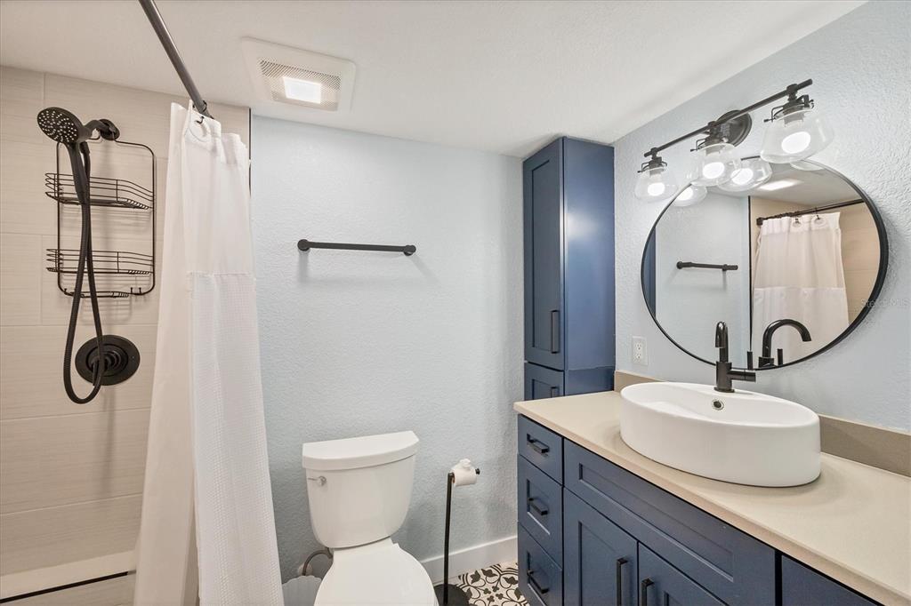 2254 Hayworth Road Port Charlotte, FL 33952 - Photo 27 of 48 a bathroom with a sink toilet and a mirror