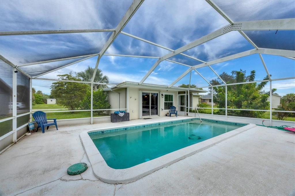 2254 Hayworth Road Port Charlotte, FL 33952 - Photo 33 of 48 a view of a swimming pool with a patio