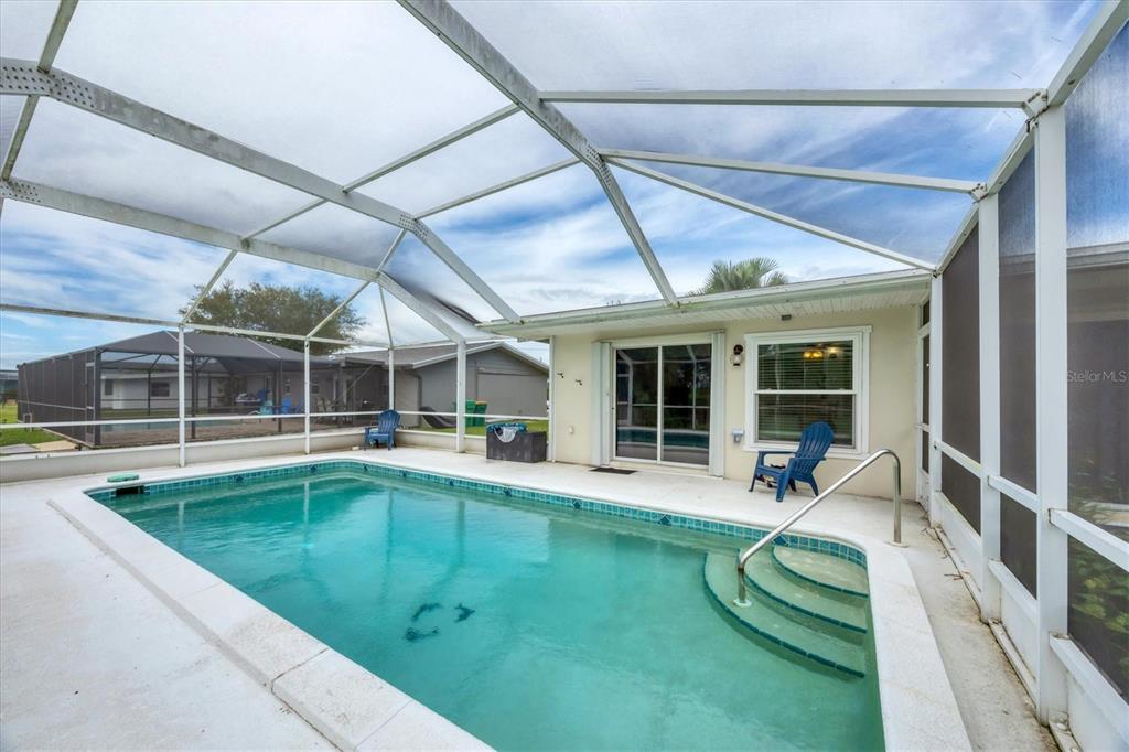 2254 Hayworth Road Port Charlotte, FL 33952 - Photo 34 of 48 a house view with a sitting space and garden view