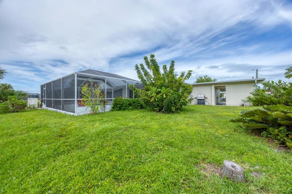 2254 Hayworth Road Port Charlotte, FL 33952 - Photo 35 of 48 a front view of a house with garden