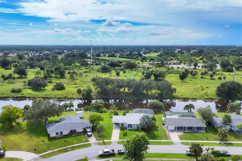 2254 Hayworth Road Port Charlotte, FL 33952 - Photo 38 of 48 an aerial view of residential houses with outdoor space and lake view