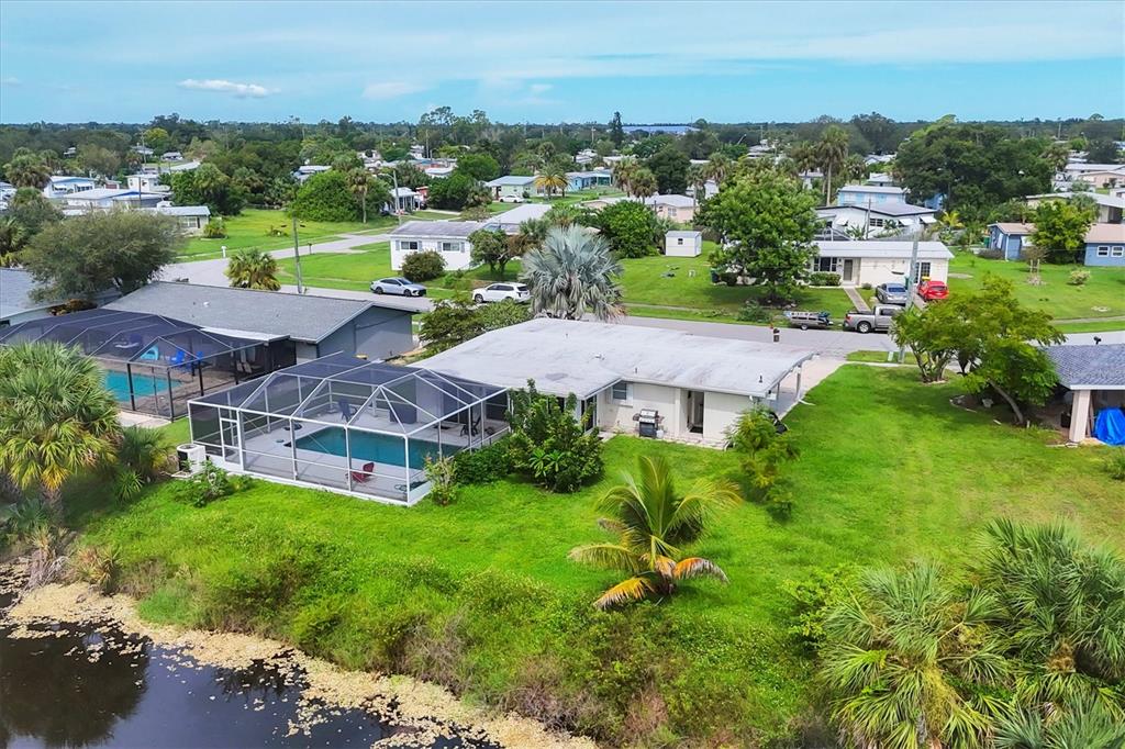 2254 Hayworth Road Port Charlotte, FL 33952 - Photo 39 of 48 an aerial view of a house with garden space and mountain view in back