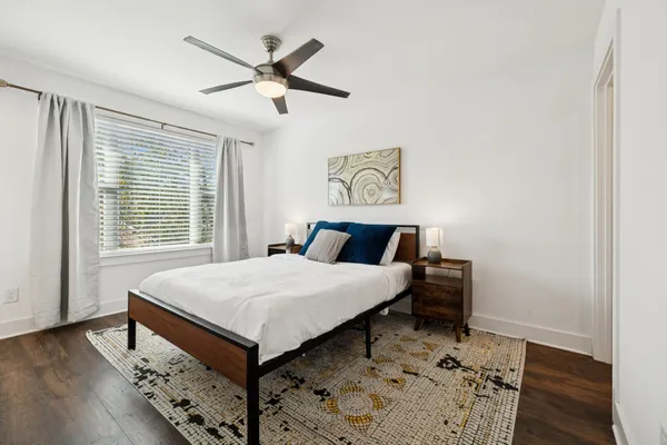 a bedroom with a bed and a table in it