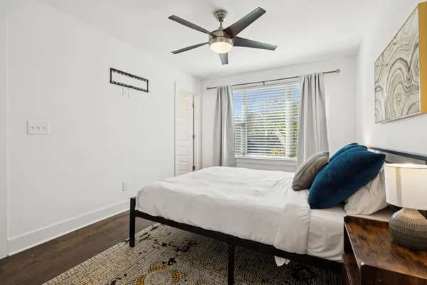 a bedroom with a bed and a window