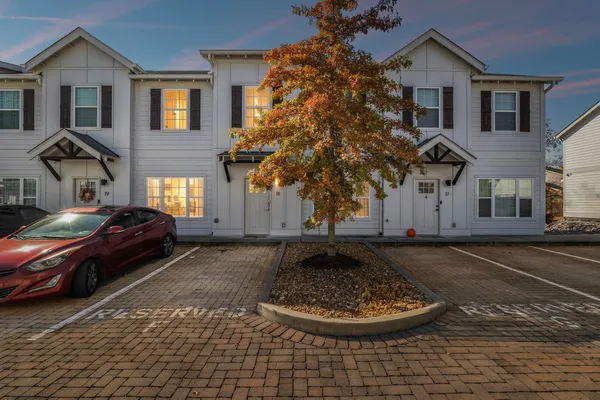 a front view of a house with a yard