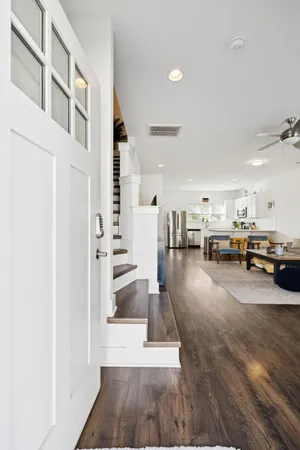 a view of a living room and entry way