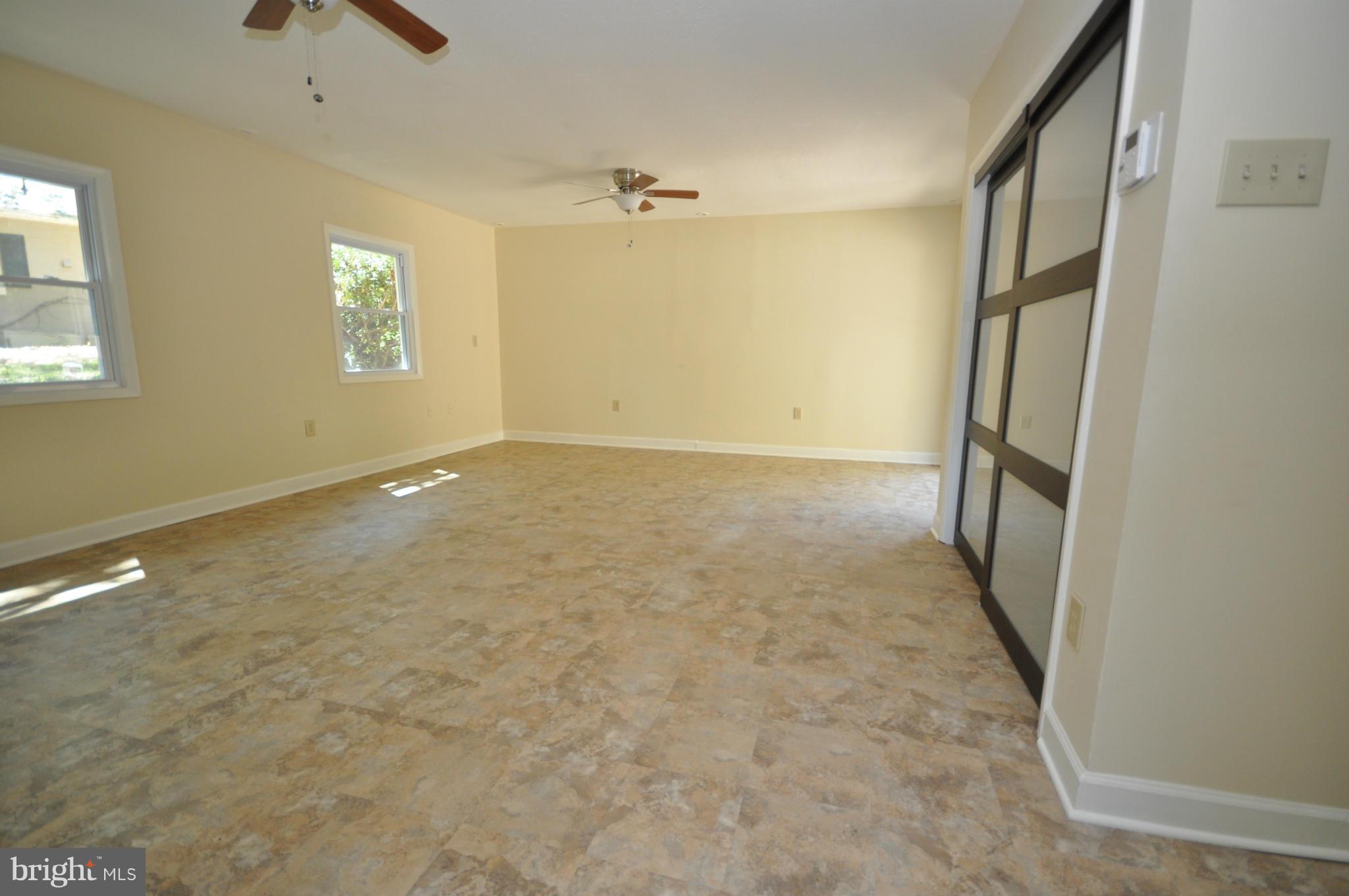 18314 Sharon Road Triangle, VA 22172 - Photo 13 of 30 an empty room with windows and closet