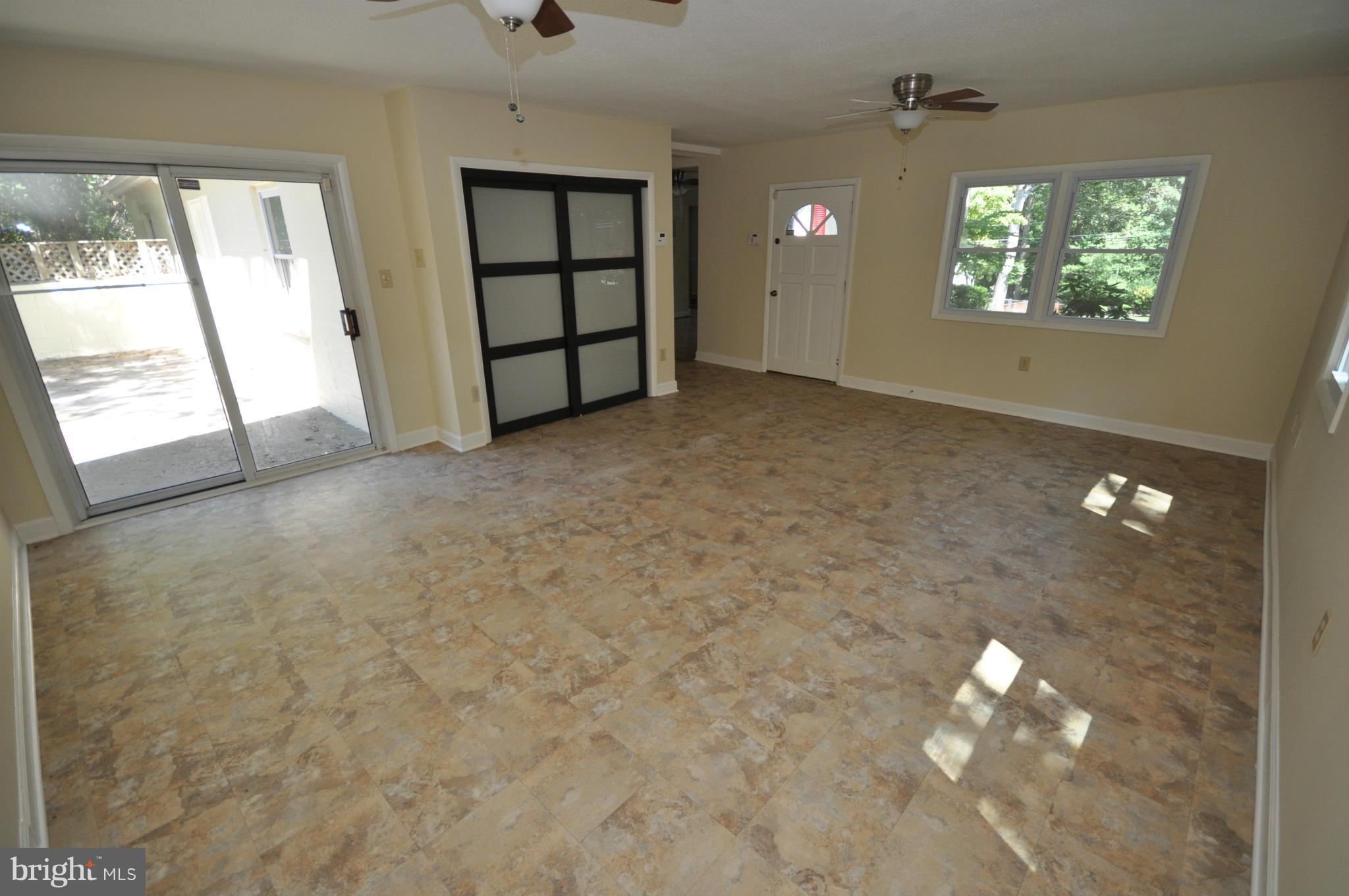 18314 Sharon Road Triangle, VA 22172 - Photo 14 of 30 an empty room with windows and entrance