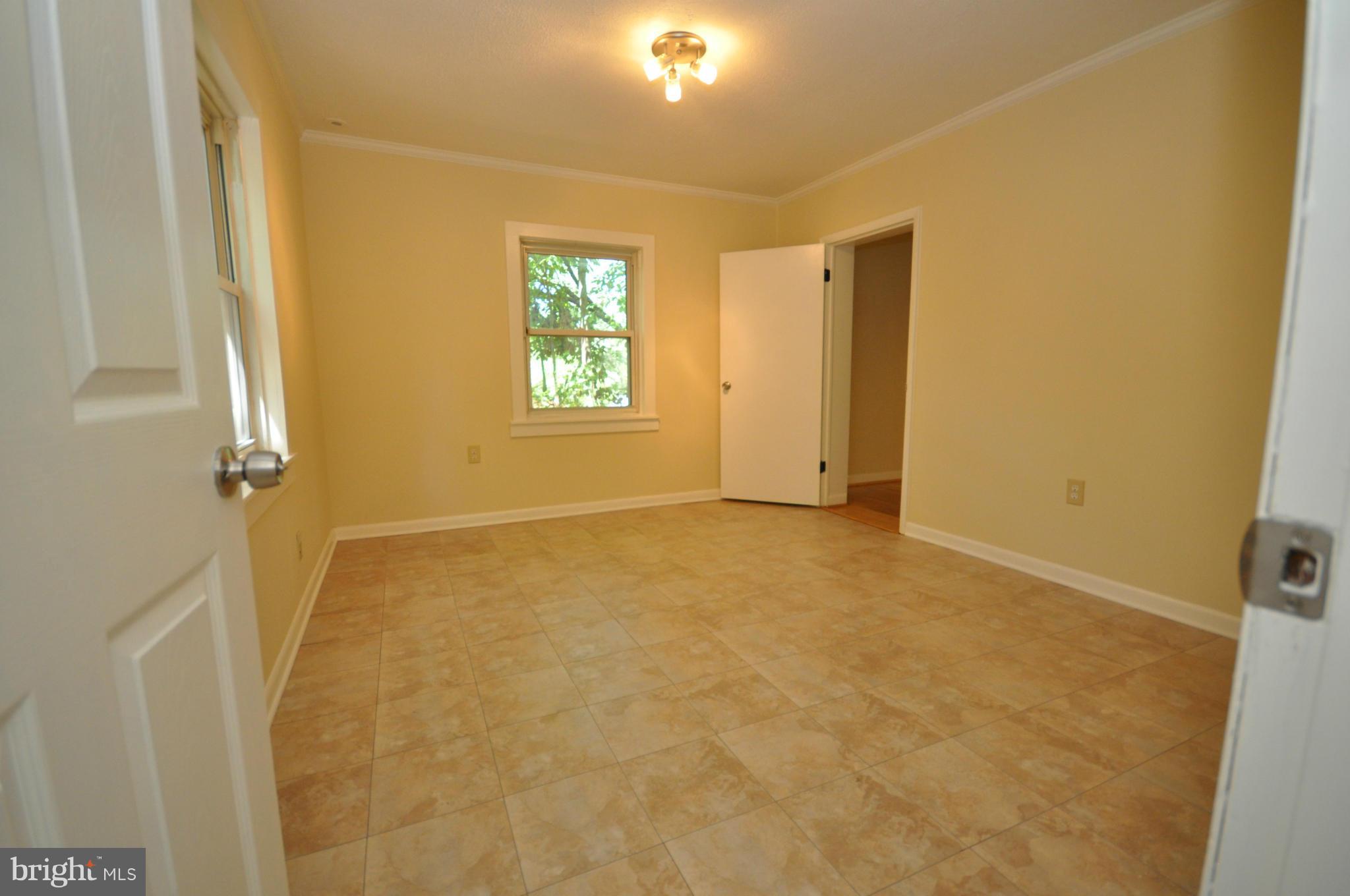 18314 Sharon Road Triangle, VA 22172 - Photo 15 of 30 a view of an empty room with a window