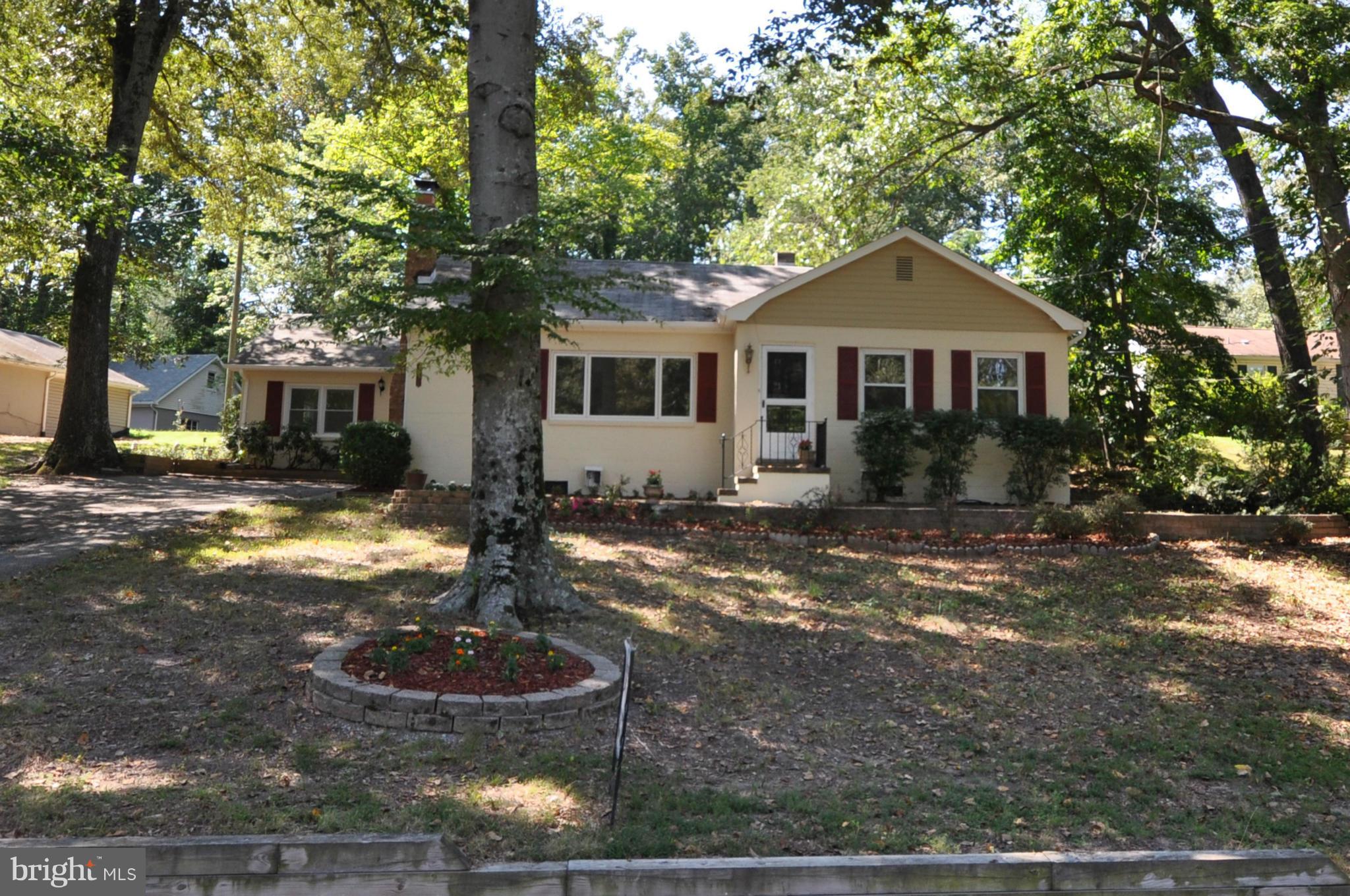 18314 Sharon Road Triangle, VA 22172 - Photo 24 of 30 a front view of a house with garden
