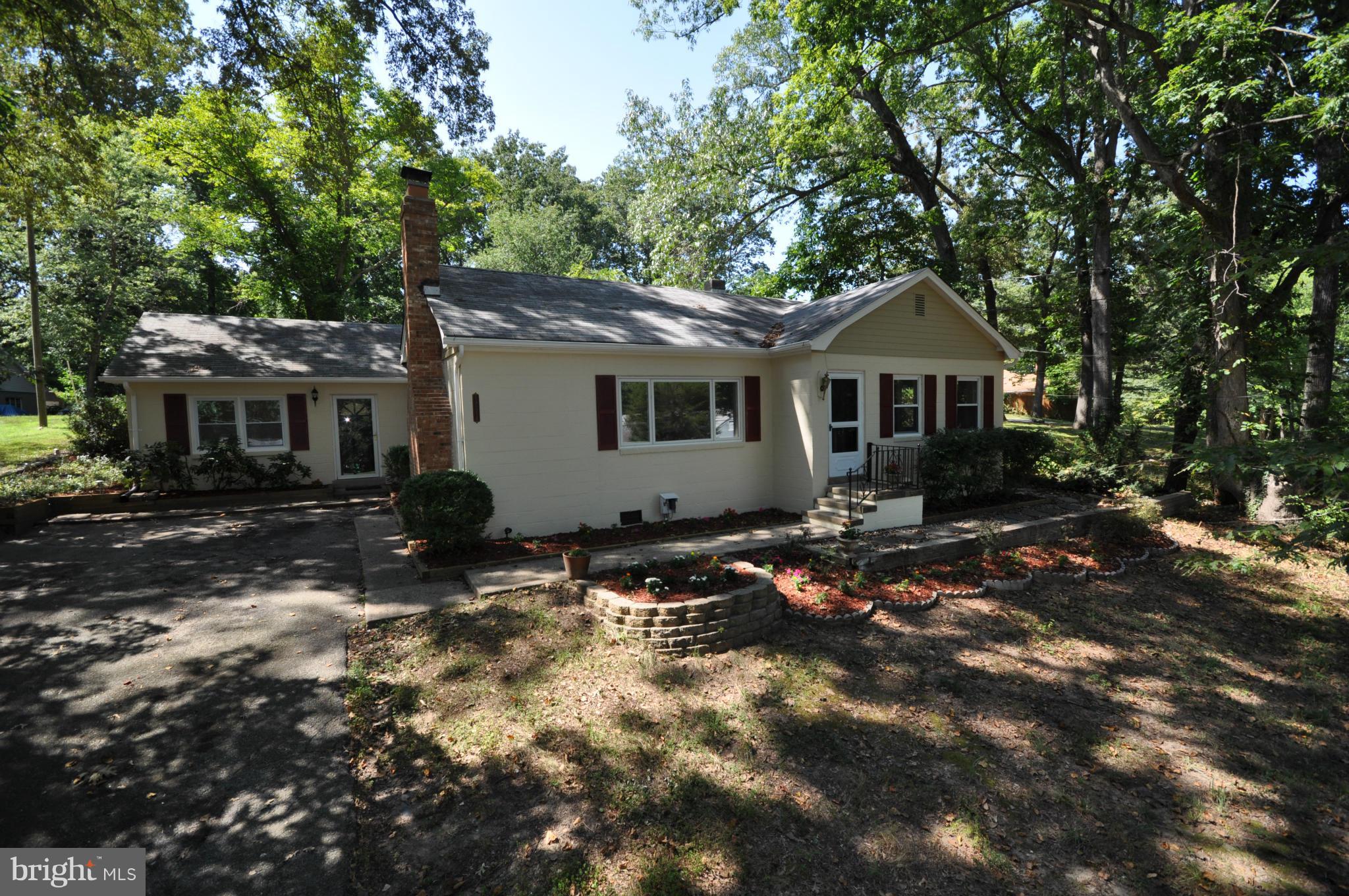 18314 Sharon Road Triangle, VA 22172 - Photo 25 of 30 a view of a house with a tree in the background