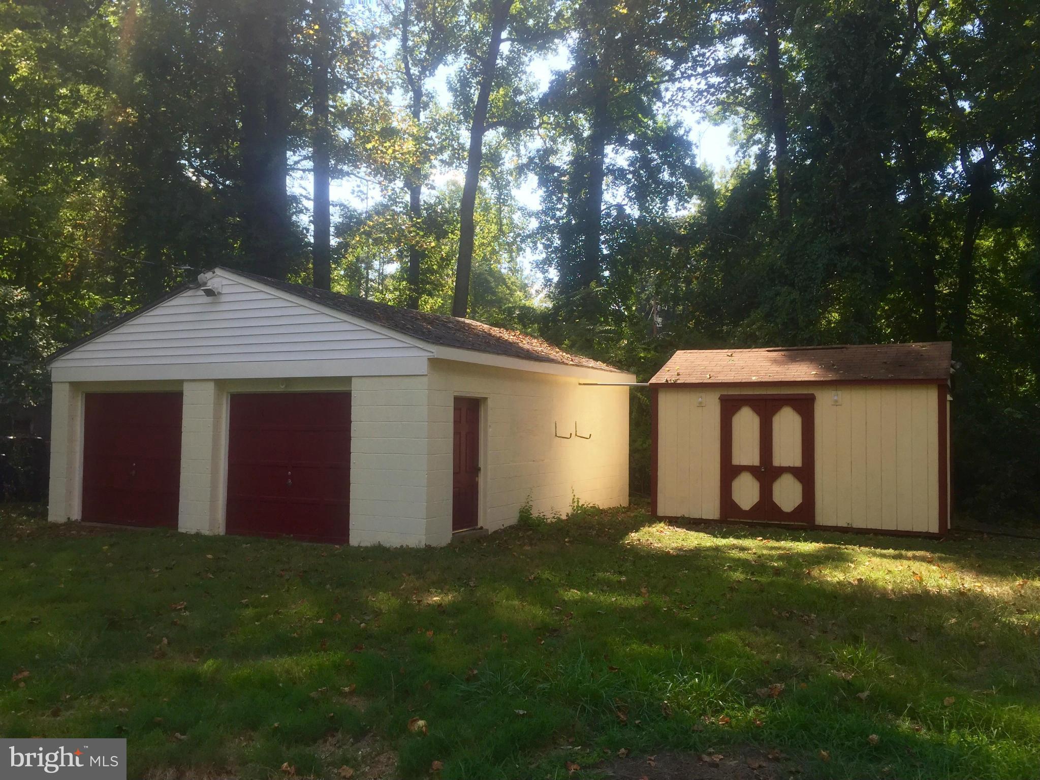 18314 Sharon Road Triangle, VA 22172 - Photo 29 of 30 a front view of house with yard and trees in the background