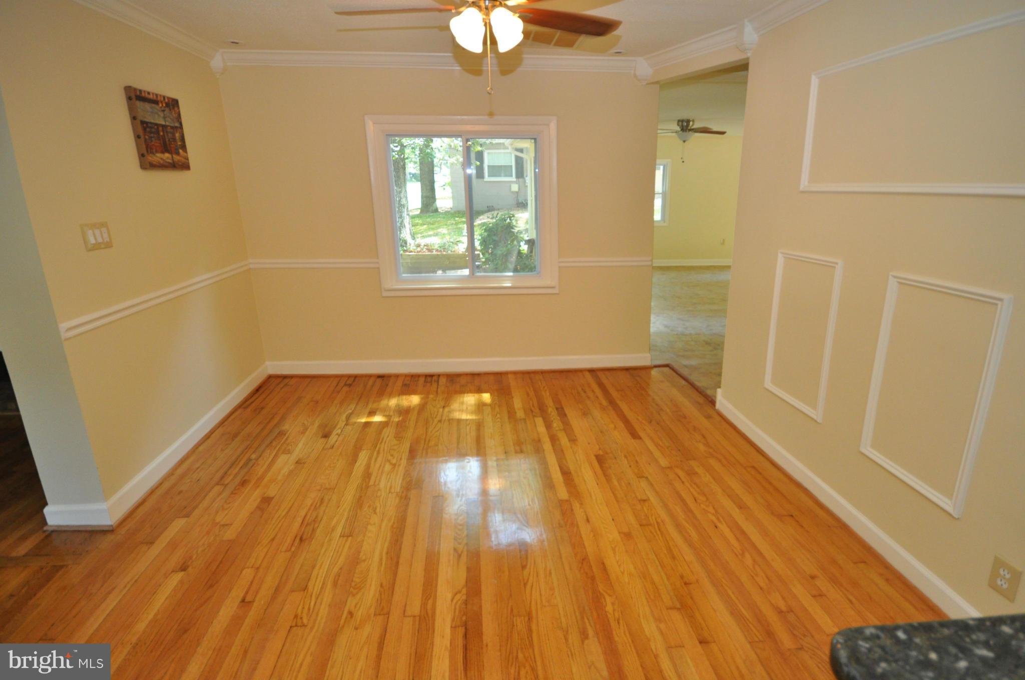 18314 Sharon Road Triangle, VA 22172 - Photo 8 of 30 a view of a room with wooden floor and fan