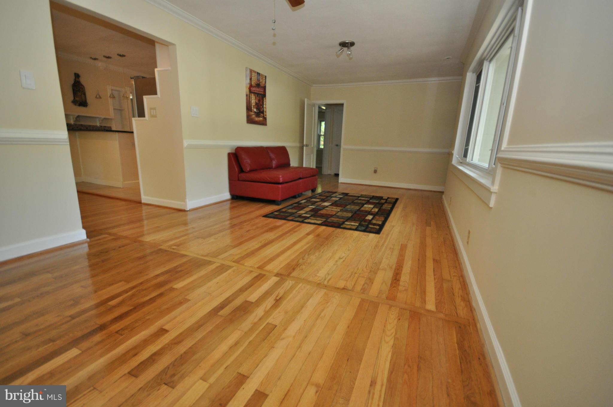 18314 Sharon Road Triangle, VA 22172 - Photo 9 of 30 a bedroom with a bed and wooden floor