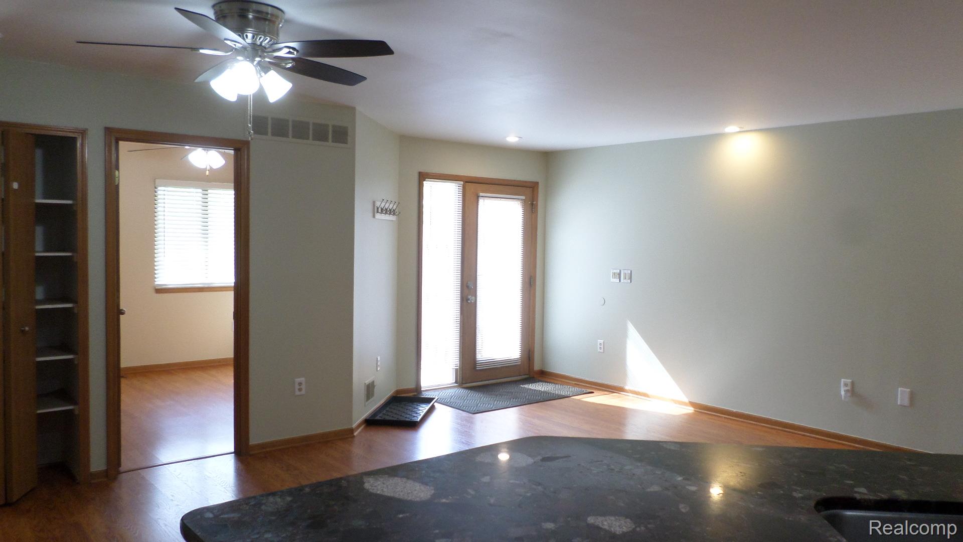 33831 Hooker Road, Unit 6 New Baltimore, MI 48047 - Photo 32 of 34 Entryway featuring light wood-style floors, plenty of natural light, a ceiling fan, and recessed lighting
