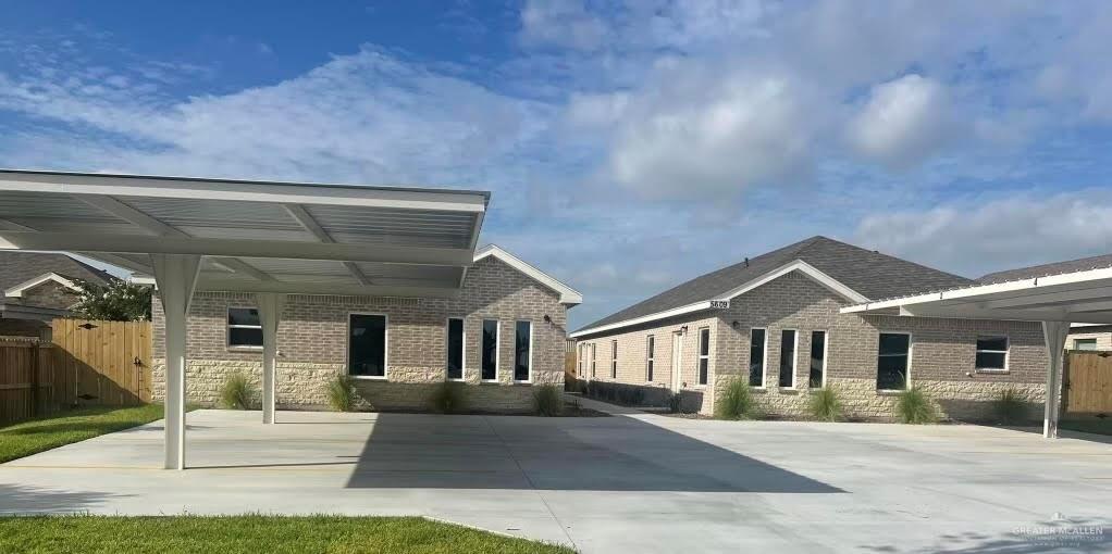 a view of a house with entrance gate