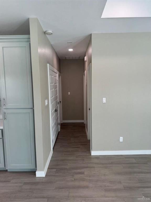 5609 Nightingale Avenue, Unit 4 Mission, TX 78573 - Photo 7 of 13 a view of a hallway with wooden floor