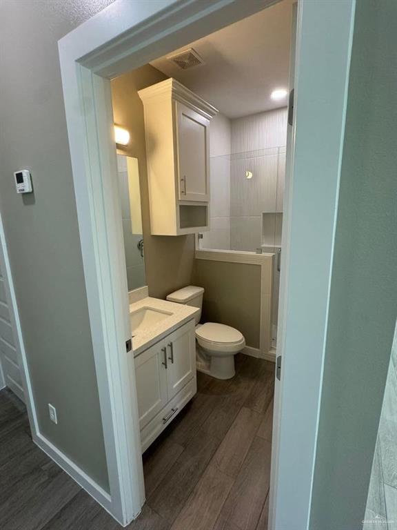5609 Nightingale Avenue, Unit 4 Mission, TX 78573 - Photo 9 of 13 a bathroom with a sink and a mirror