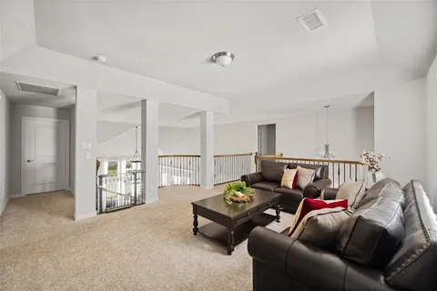 a living room with furniture and a table