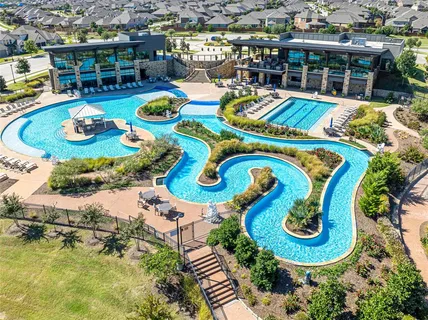 an aerial view of a house with outdoor seating swimming pool and outdoor seating
