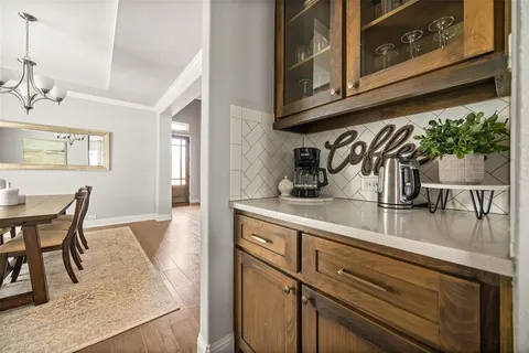 a kitchen with stainless steel appliances granite countertop a sink and cabinets