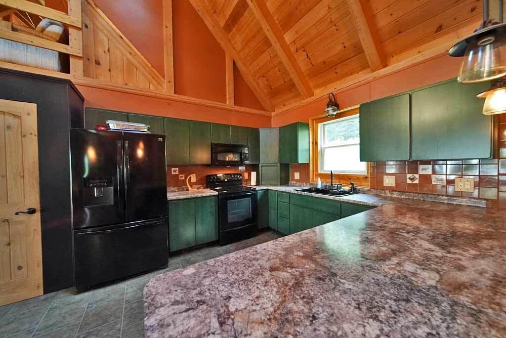 590 W Road Portage, ME 04768 - Photo 22 of 136 kitchen-me-lake-home