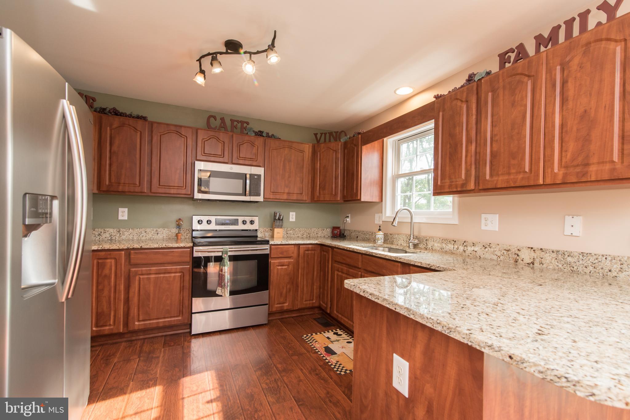 24 Jack Rabbit Lane Ranson, WV 25438 - Photo 15 of 48 Granite, stainless appliances and laminate floors!