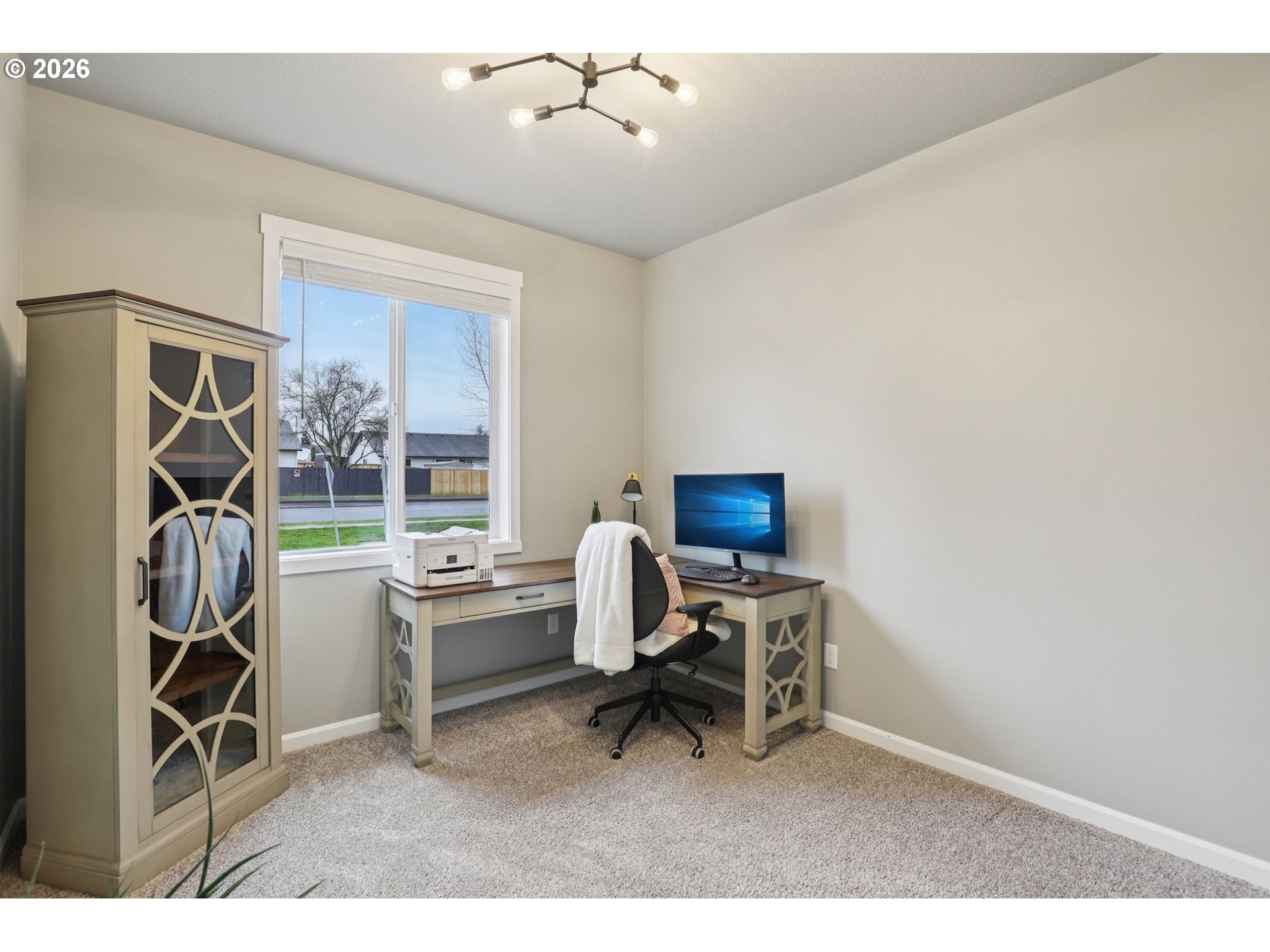 604 Northwest 25th Way Battle Ground, WA 98604 - Photo 26 of 33 a view of a workspace with furniture and a window