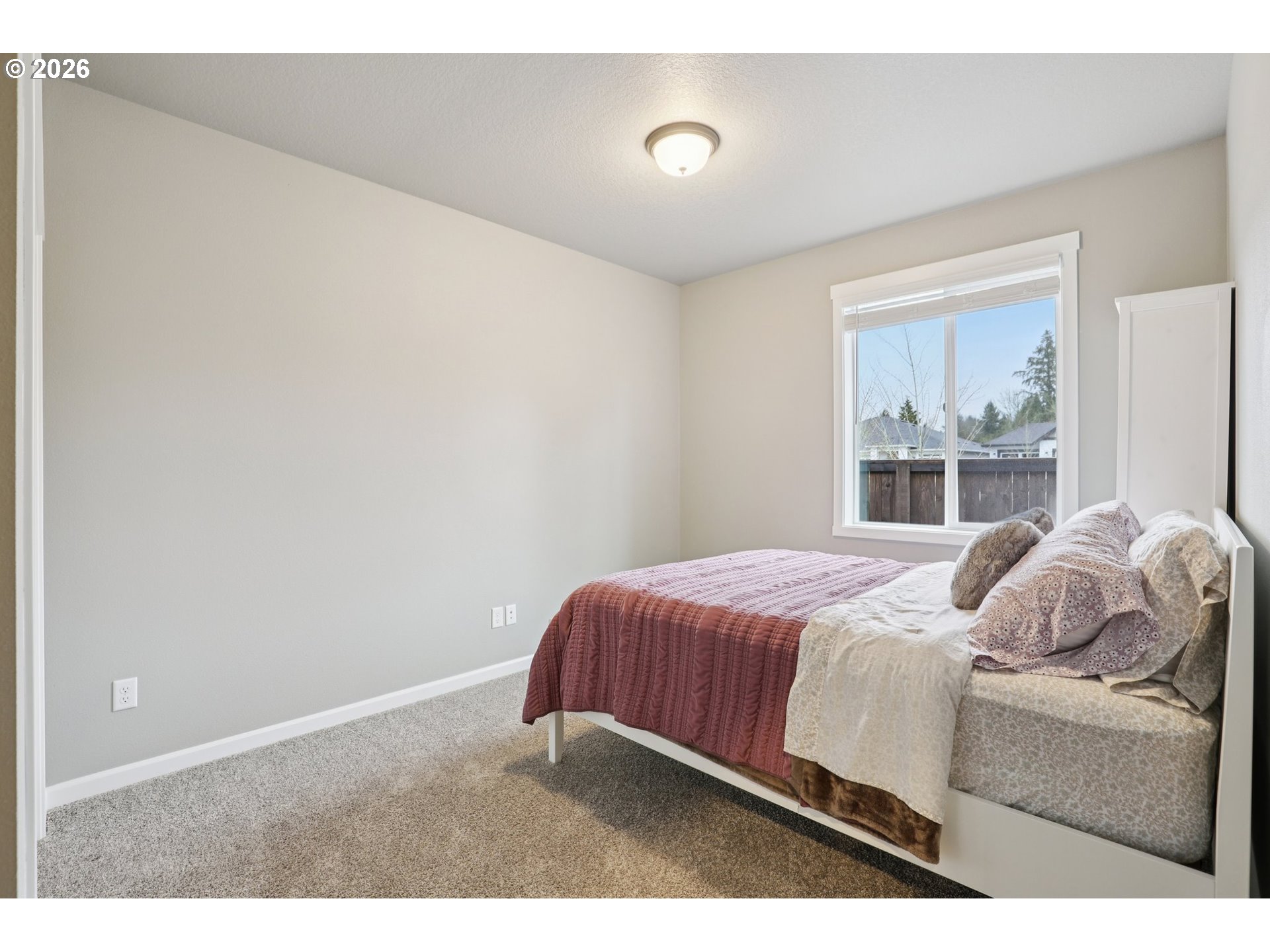 604 Northwest 25th Way Battle Ground, WA 98604 - Photo 28 of 33 a bedroom with a bed and a window