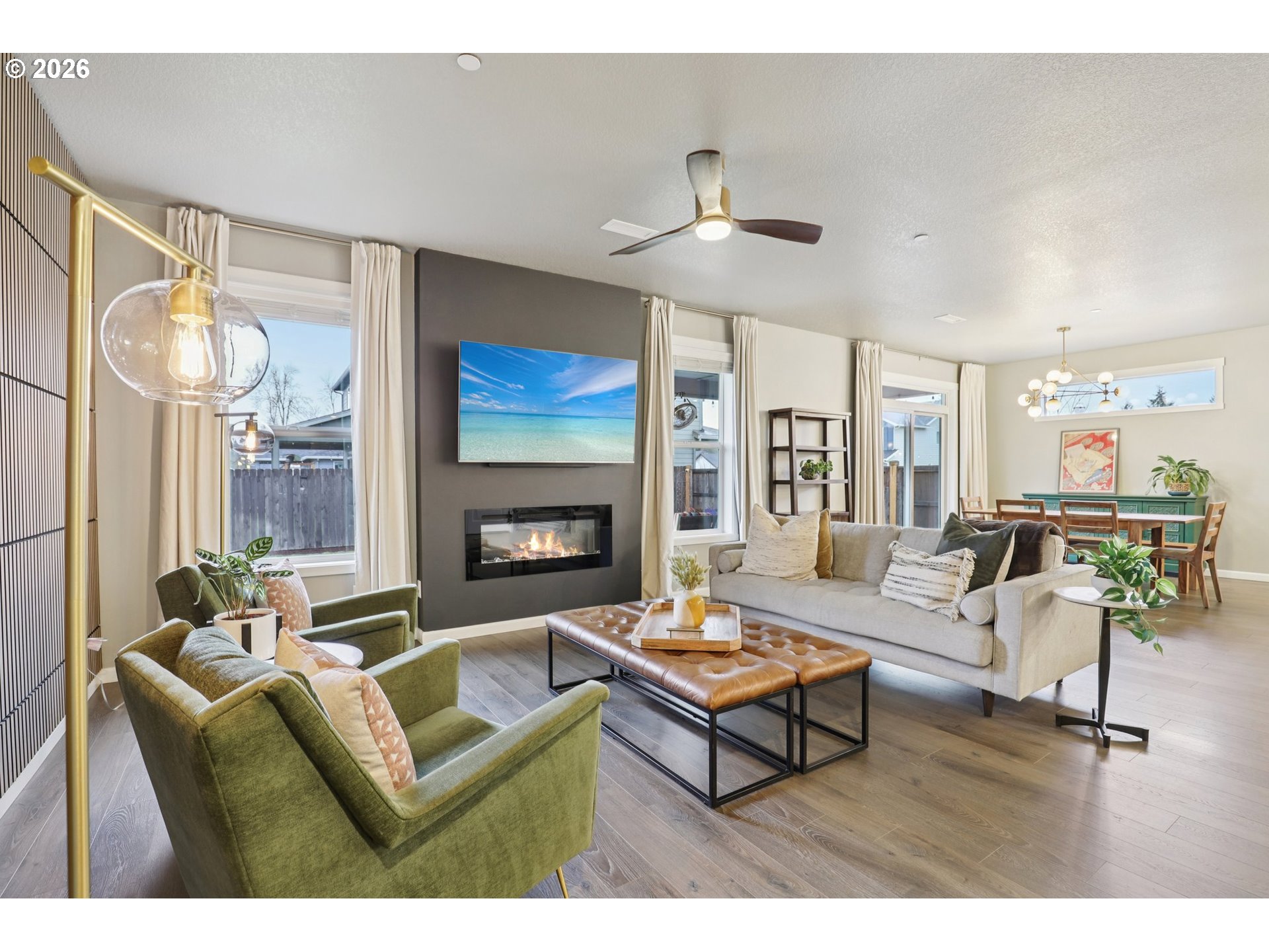 604 Northwest 25th Way Battle Ground, WA 98604 - Photo 3 of 33 a living room with furniture a flat screen tv and a fireplace