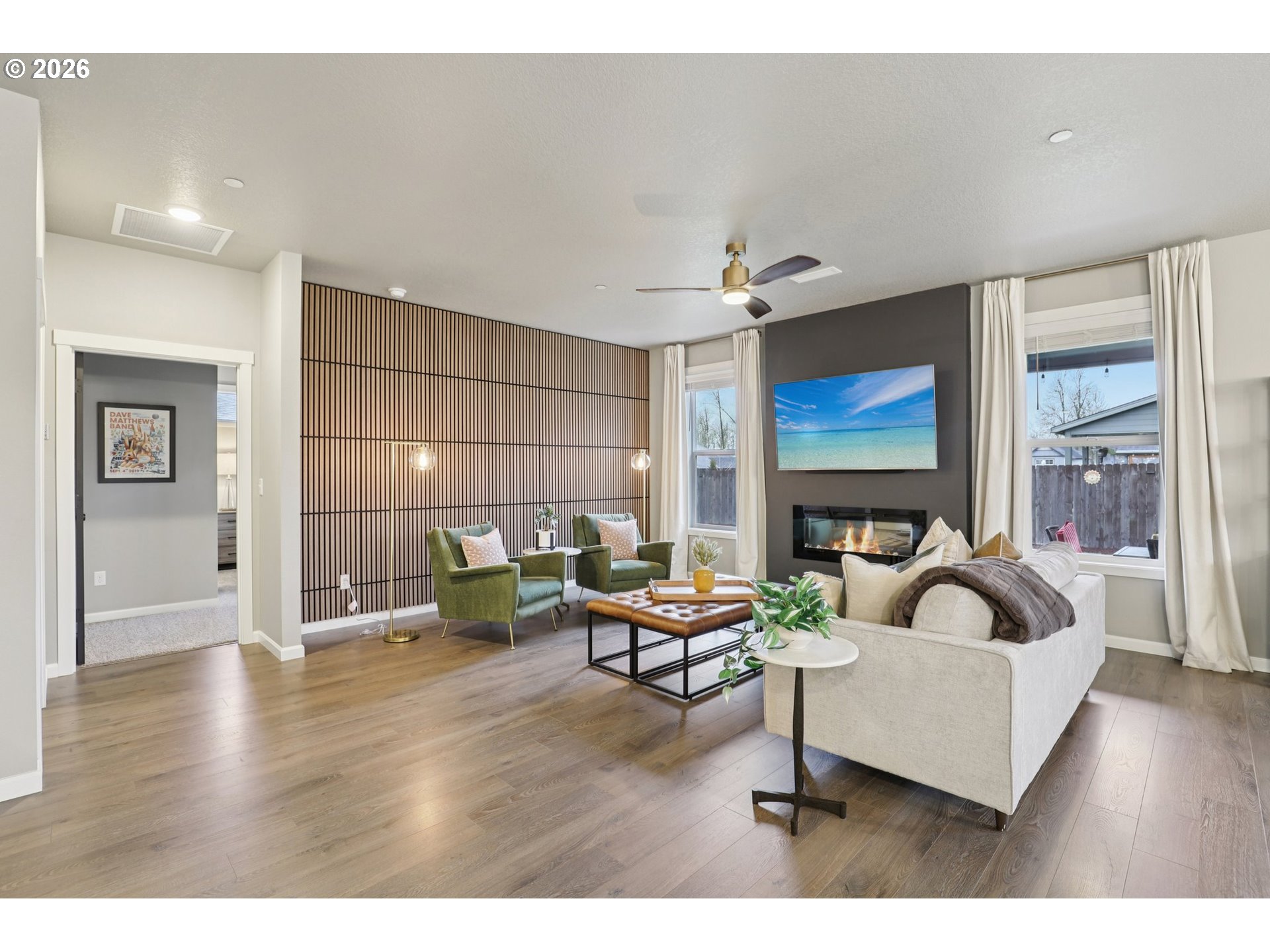 604 Northwest 25th Way Battle Ground, WA 98604 - Photo 5 of 33 a living room with furniture and a flat screen tv
