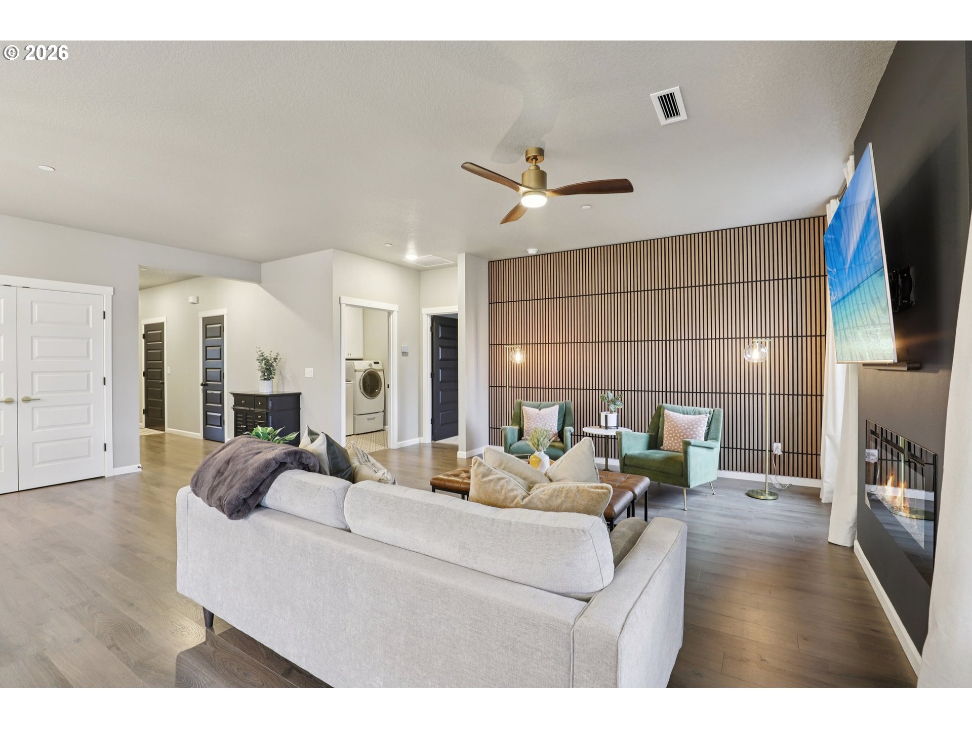 604 Northwest 25th Way Battle Ground, WA 98604 - Photo 6 of 33 a living room with furniture and a flat screen tv
