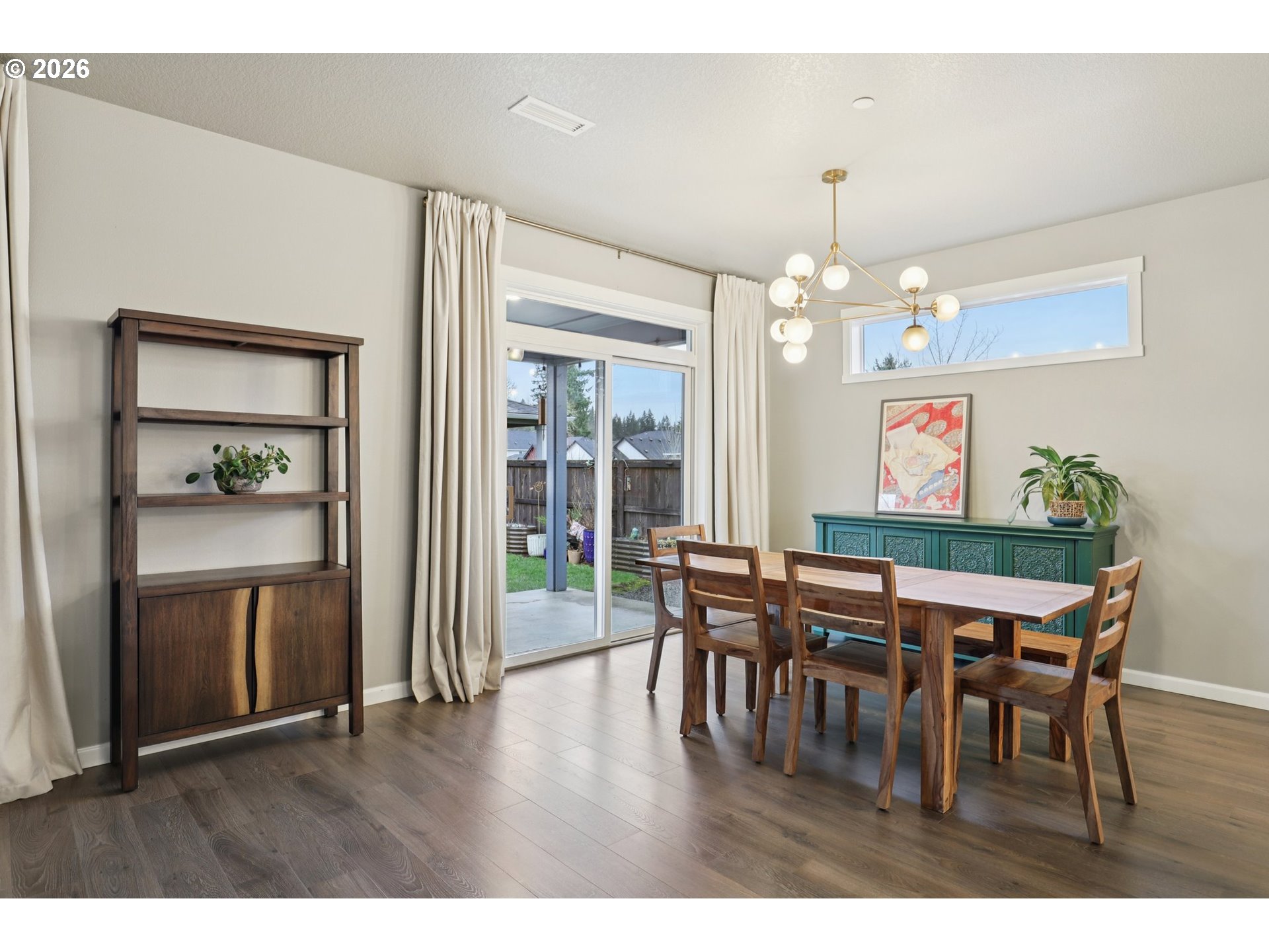 604 Northwest 25th Way Battle Ground, WA 98604 - Photo 9 of 33 a view of a dining room with furniture and wooden floor