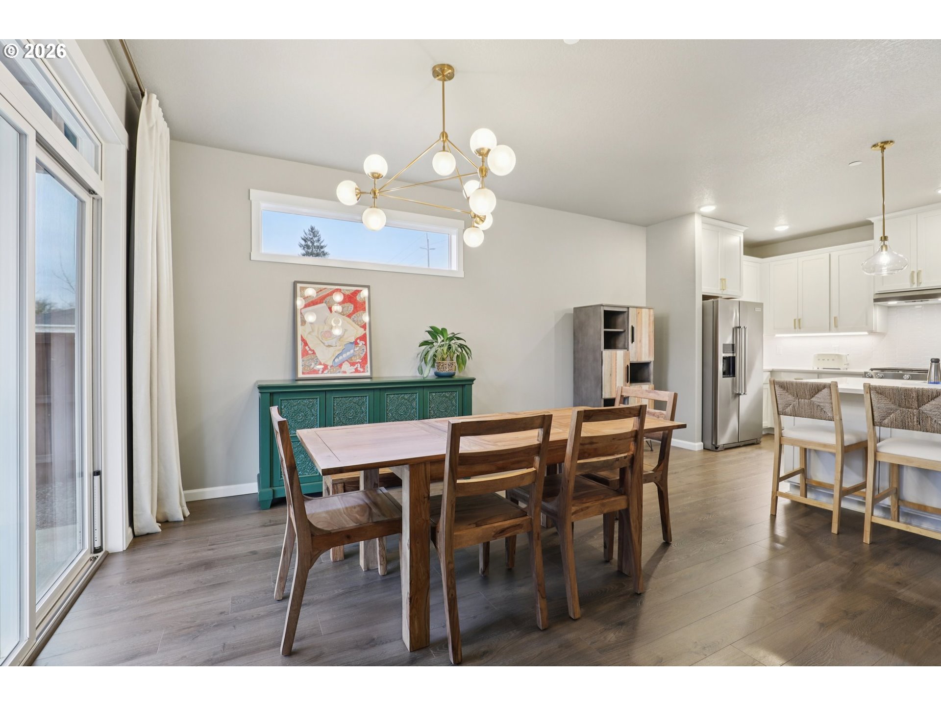 604 Northwest 25th Way Battle Ground, WA 98604 - Photo 10 of 33 a view of a dining room with furniture and wooden floor
